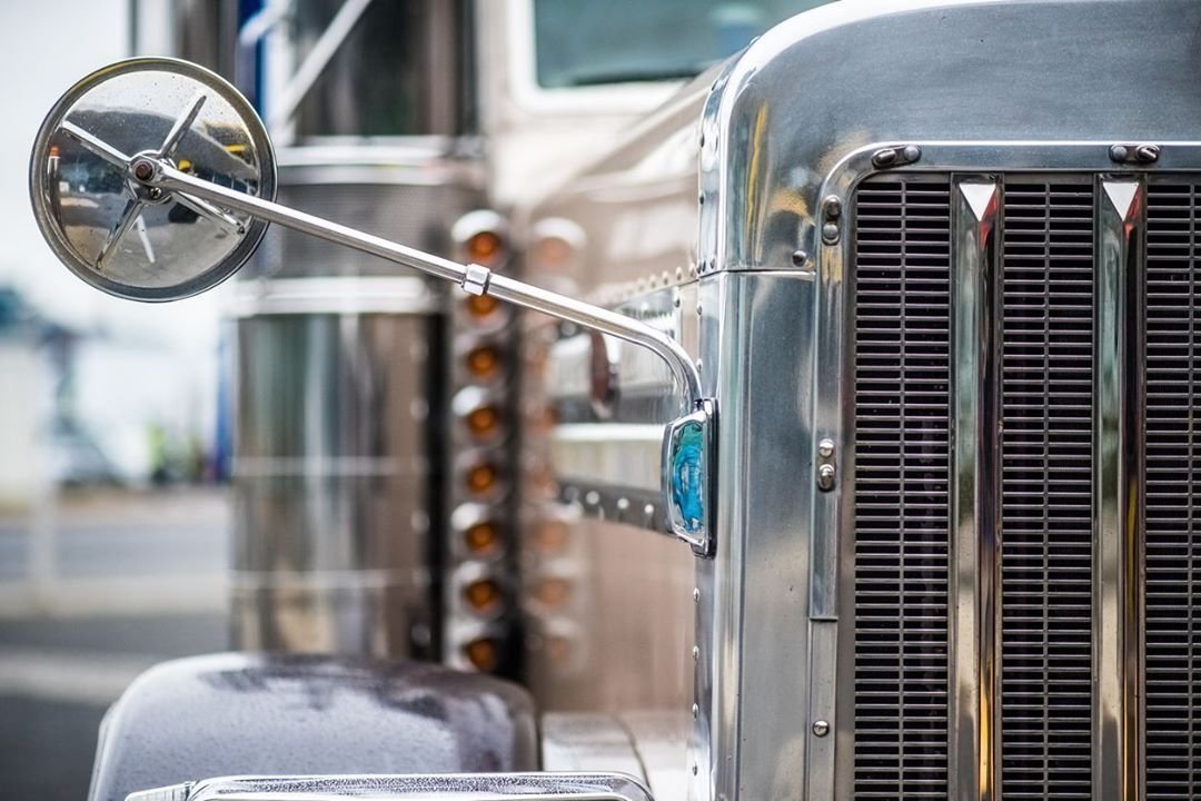 Chrome grille and mirror of a class 8 truck